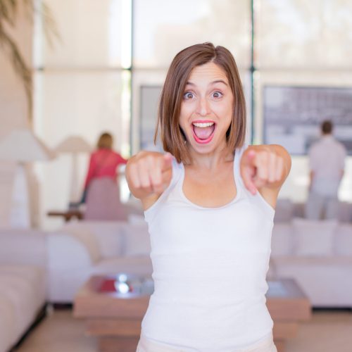 young woman pointing in a resort